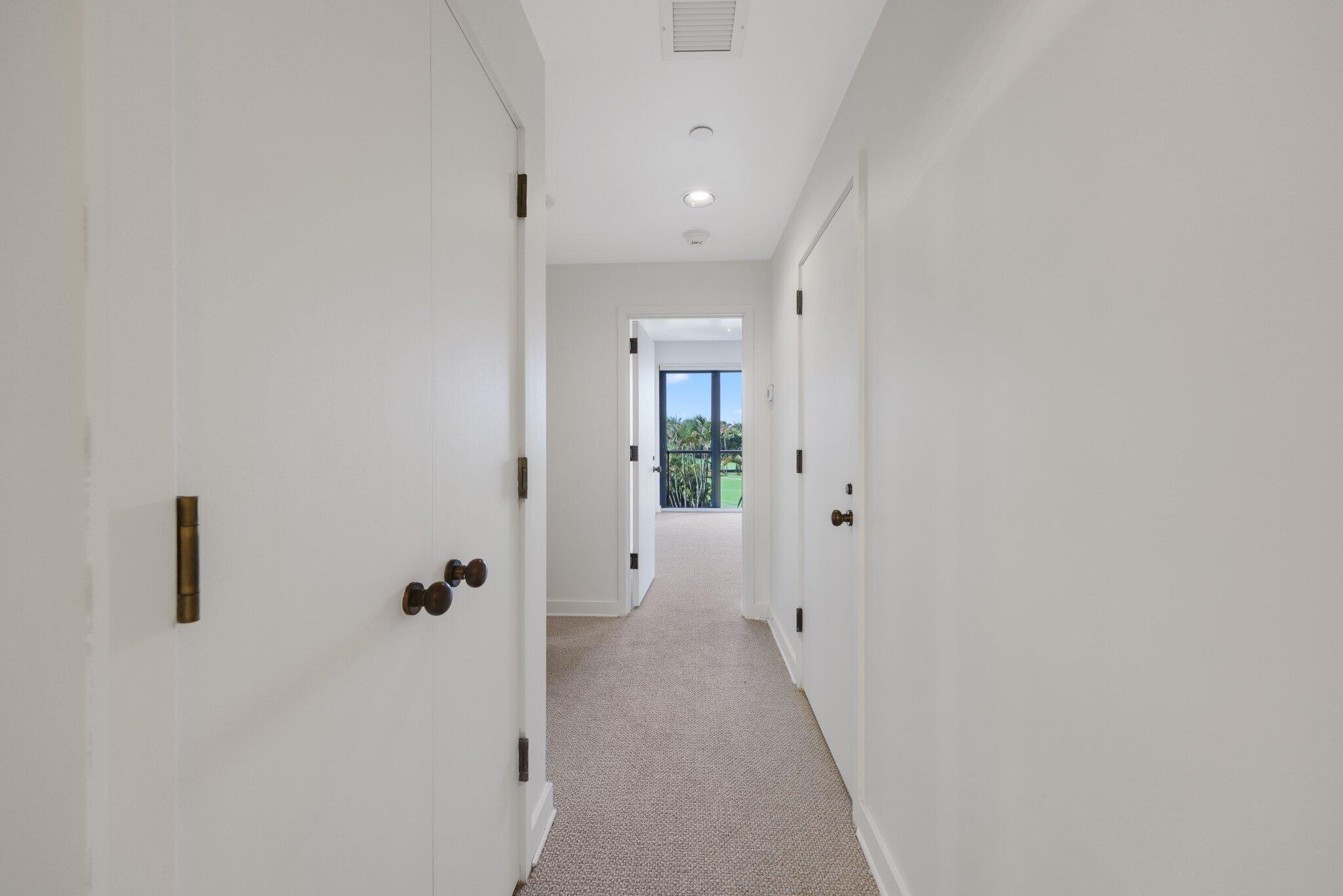 2 North Breakers Row, Unit S32 Palm Beach, FL 33480 - Photo 46 of 77 a view of a hallway with white walls