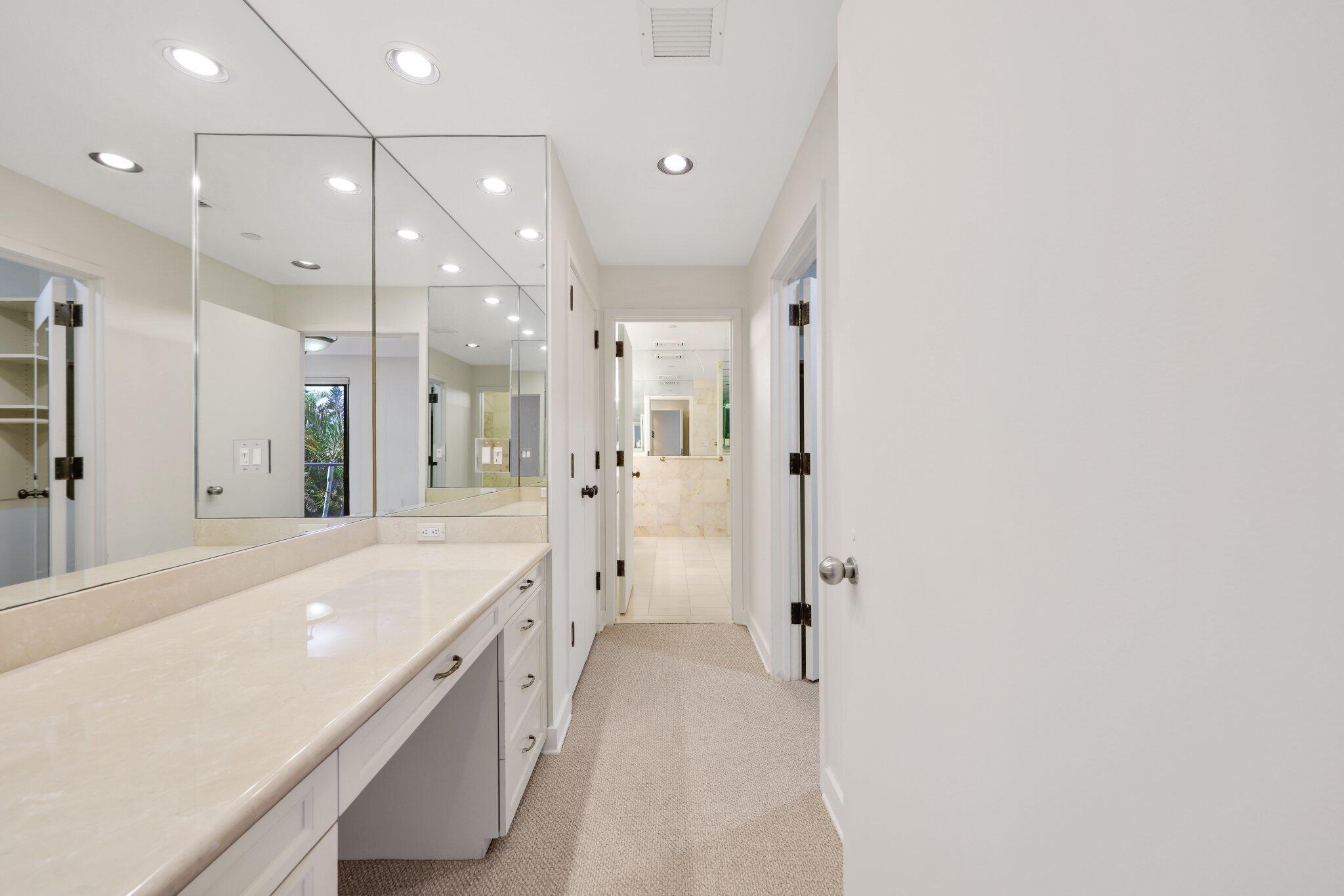 2 North Breakers Row, Unit S32 Palm Beach, FL 33480 - Photo 49 of 77 a spacious bathroom with a granite countertop sink a mirror and shower