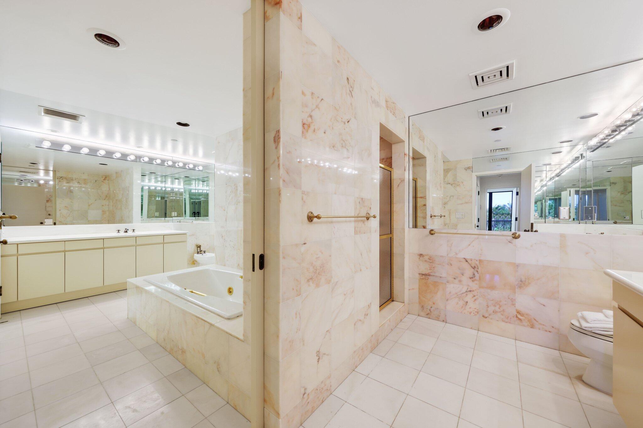 2 North Breakers Row, Unit S32 Palm Beach, FL 33480 - Photo 50 of 77 a bathroom with a tub sink and mirror