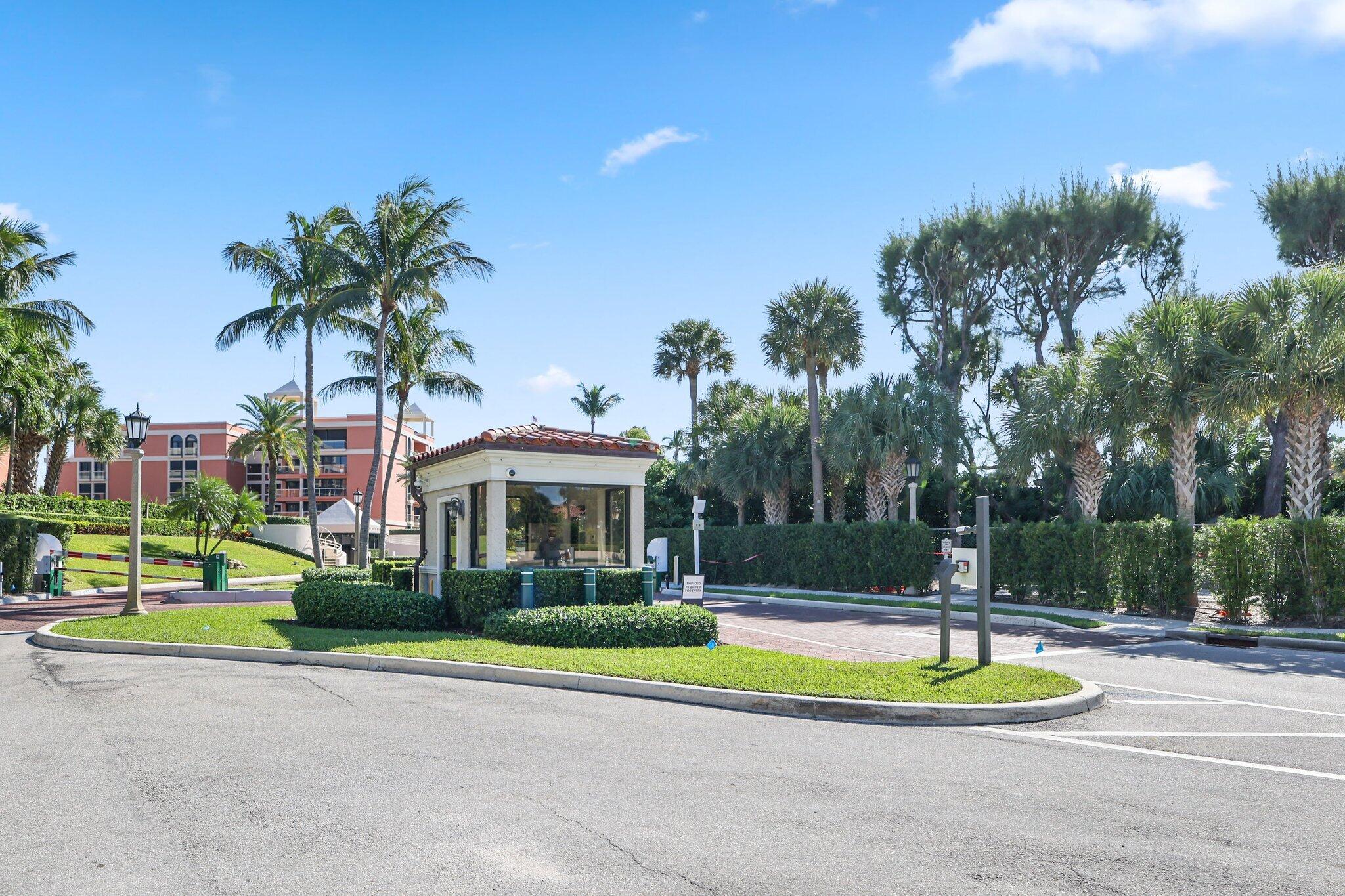 2 North Breakers Row, Unit S32 Palm Beach, FL 33480 - Photo 7 of 77 a view of a white house with a swimming pool and lawn chairs