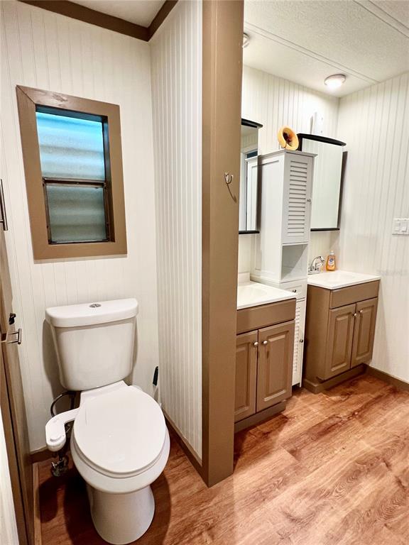 2 South Bobwhite Road Wildwood, FL 34785 - Photo 34 of 57 a bathroom with a toilet sink and mirror