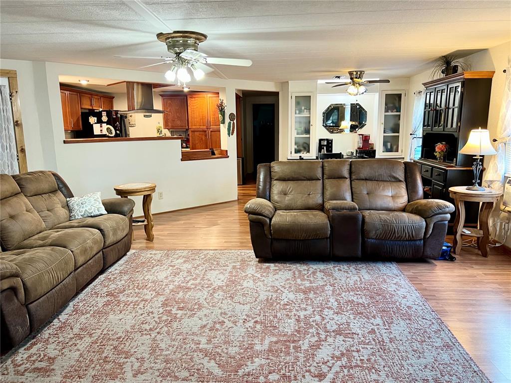 2 South Bobwhite Road Wildwood, FL 34785 - Photo 5 of 57 a living room with furniture and a flat screen tv
