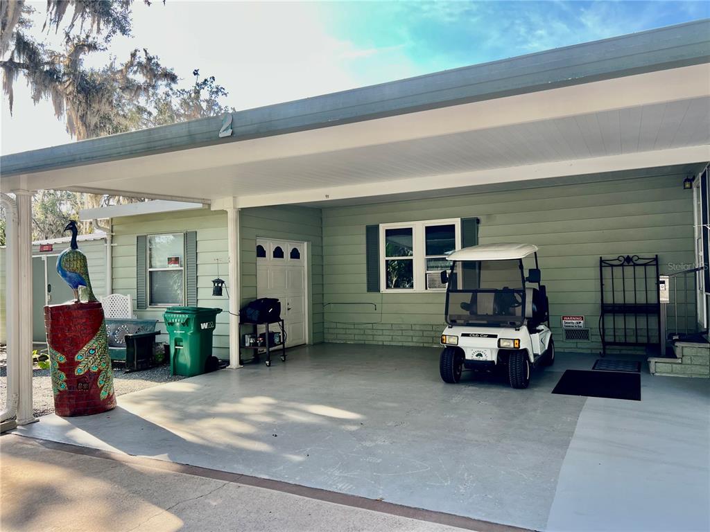 2 South Bobwhite Road Wildwood, FL 34785 - Photo 55 of 57 a living room with furniture and a flat screen tv