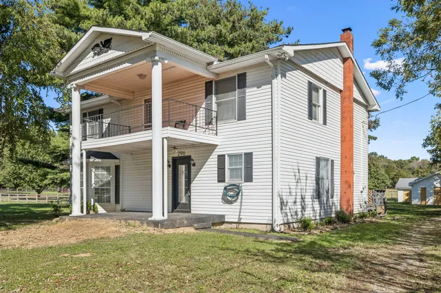 a kitchen with granite countertop a sink and cabinets