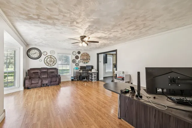 a kitchen with a sink appliances and cabinets