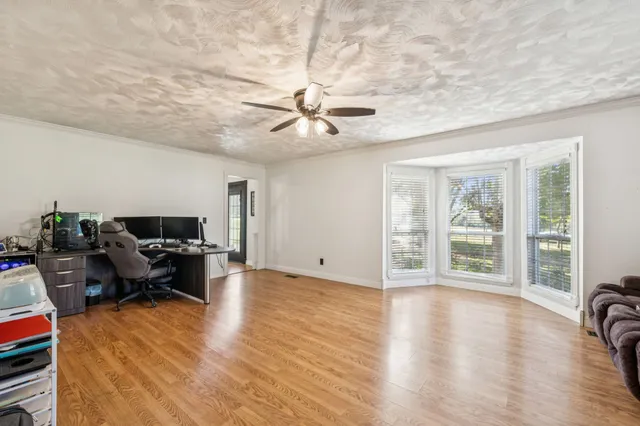 a view of a patio with chairs and a table