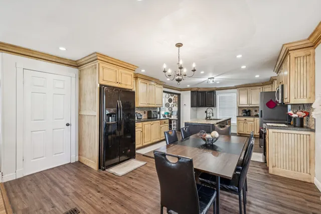 a view of a house with a yard patio and swimming pool