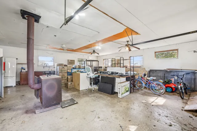 a room with lots of furniture and clutter