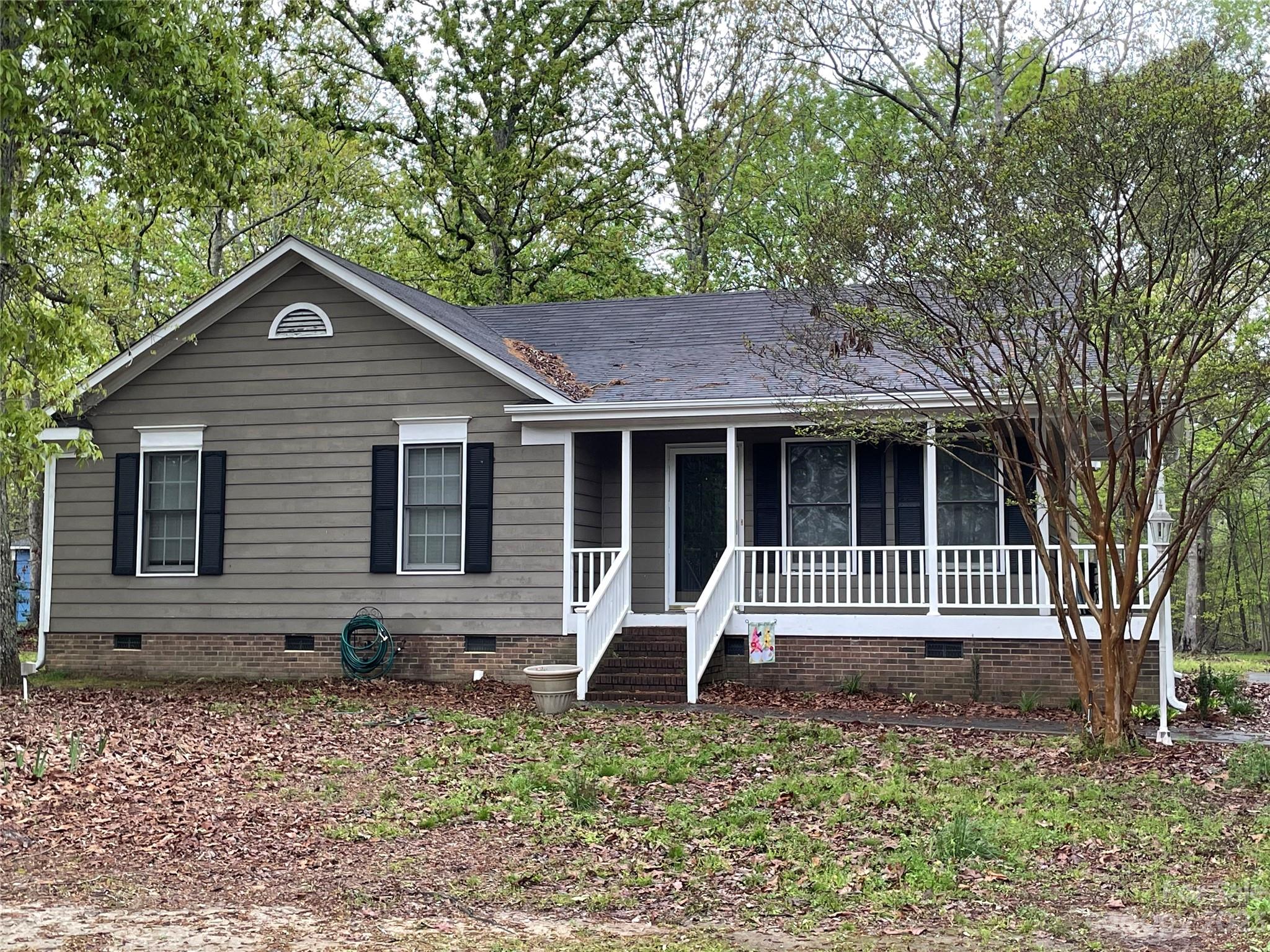3885 Taxahaw Road Lancaster, SC 29720 - Photo 1 of 18 a front view of a house with garden