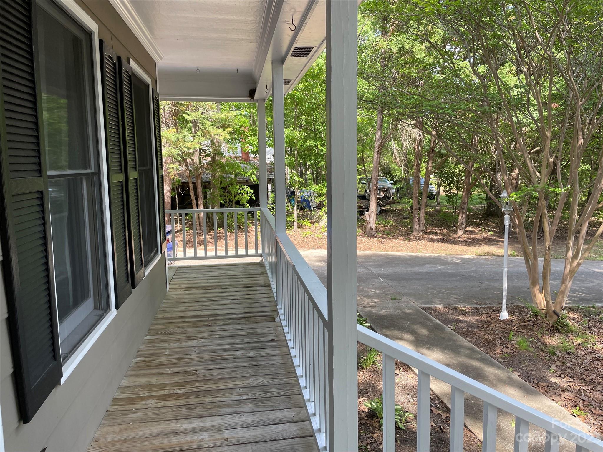 3885 Taxahaw Road Lancaster, SC 29720 - Photo 12 of 18 a view of a porch with wooden floor and wooden fence
