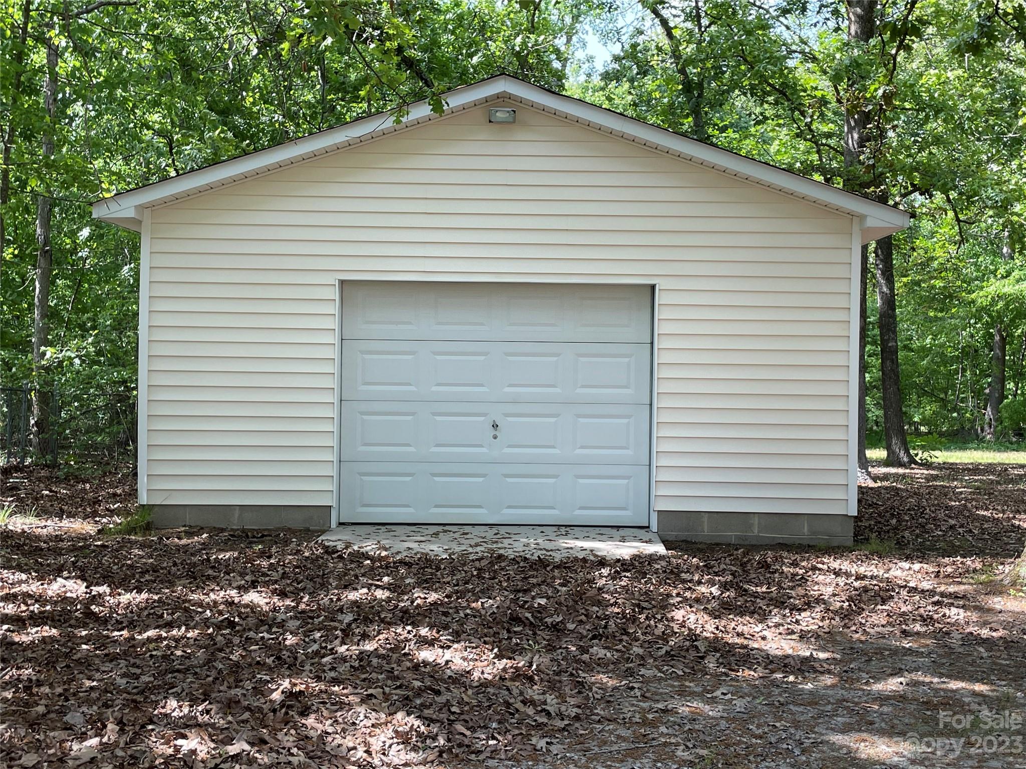 3885 Taxahaw Road Lancaster, SC 29720 - Photo 13 of 18 a small white house with a white roof and a yard