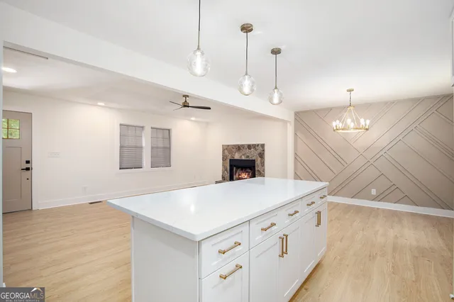a view of a kitchen and chandelier