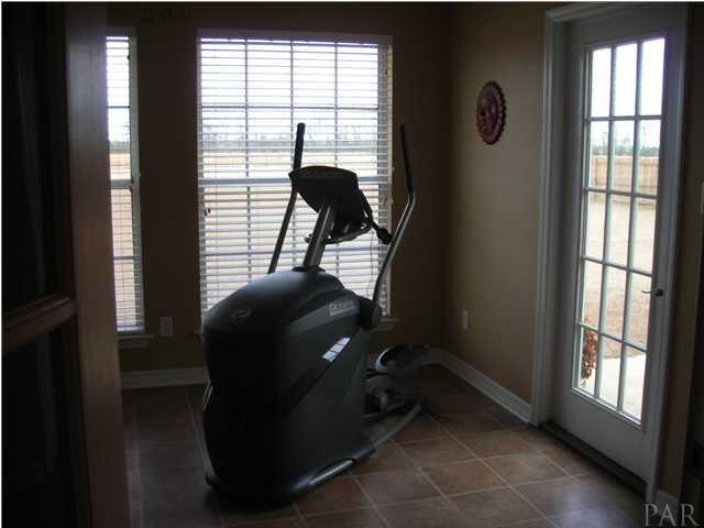 3372 North Simmons Road Jay, FL 32565 - Photo 16 of 24 Florida Roomleading to the back yard. Many uses here.