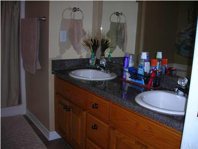 3372 North Simmons Road Jay, FL 32565 - Photo 20 of 24 Master Bath with hardwood cabinets and nice pleasing countertops