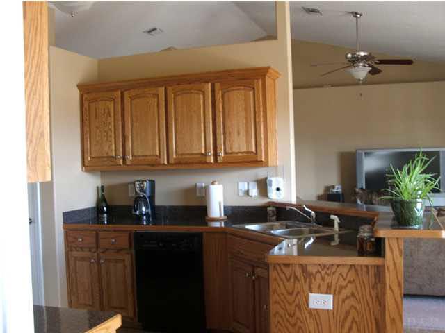 3372 North Simmons Road Jay, FL 32565 - Photo 10 of 24 Kitchen with upgraded appliances including the refrigerator