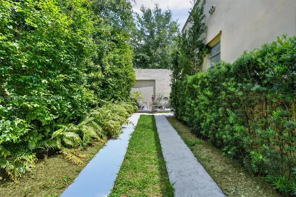a view of a garden with pathway