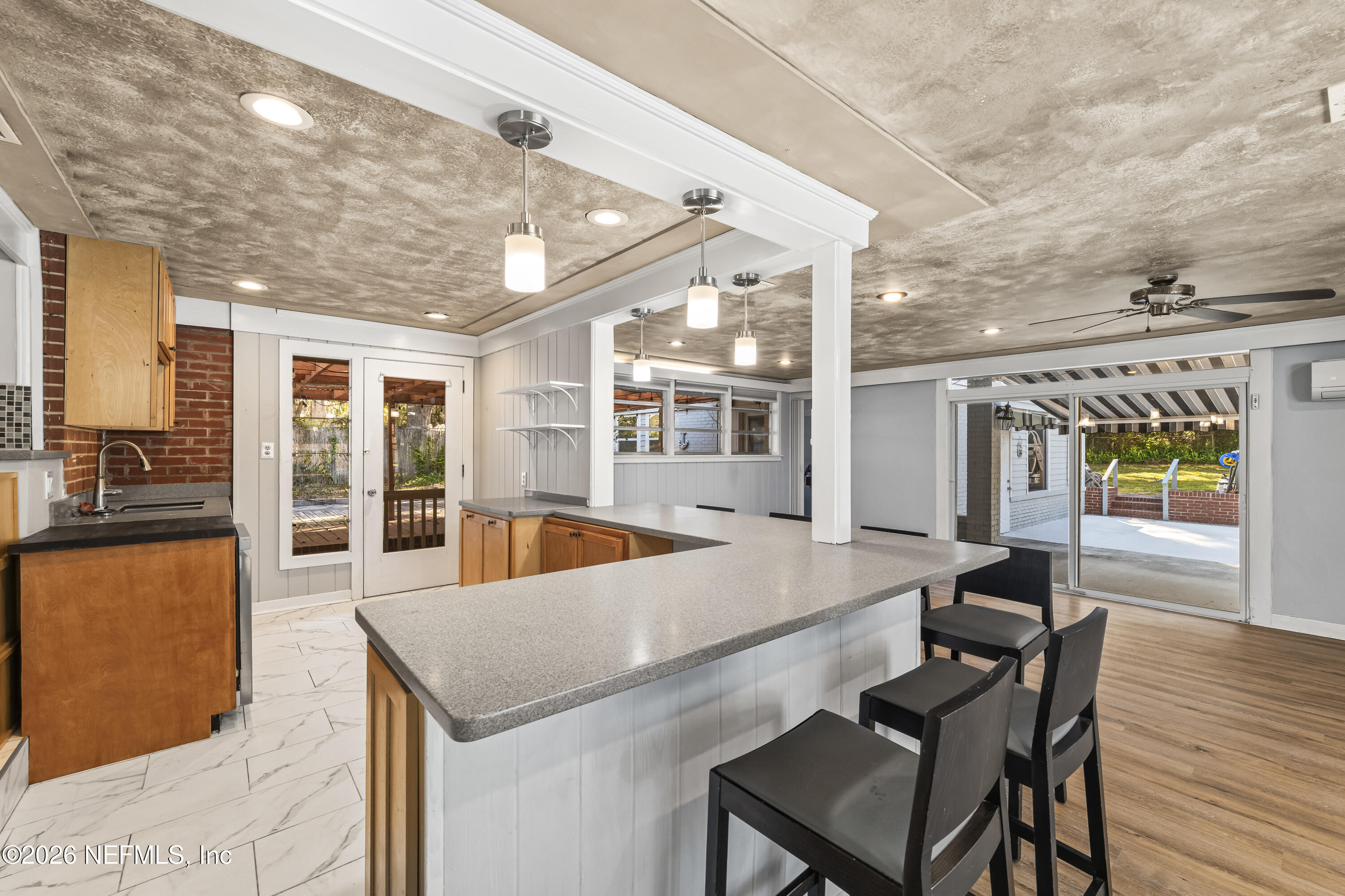 10612 Fort Caroline Road Jacksonville, FL 32225 - Photo 18 of 51 a view of a dining room with furniture wooden floor and chandelier