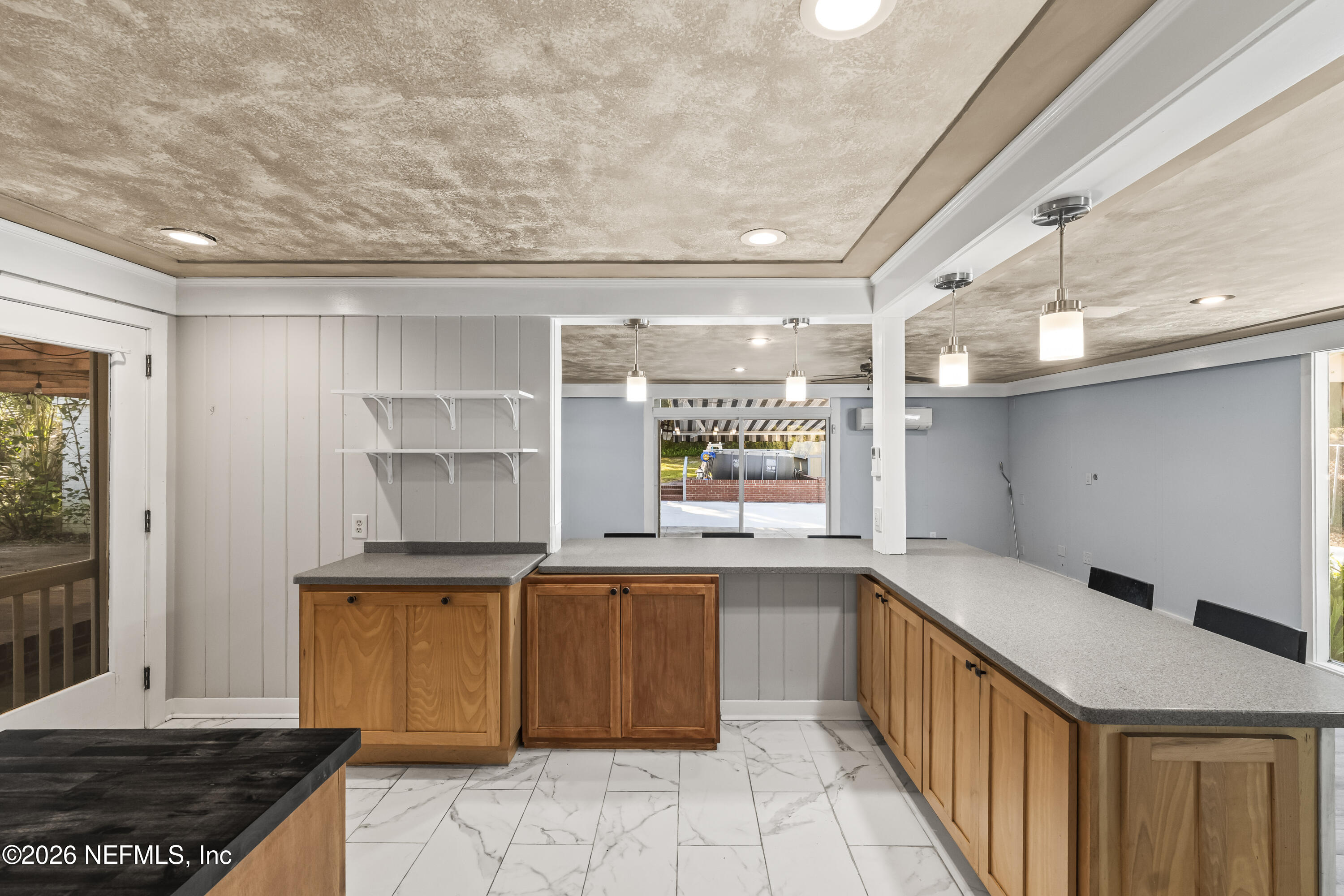 10612 Fort Caroline Road Jacksonville, FL 32225 - Photo 19 of 51 a kitchen with granite countertop a sink and cabinets