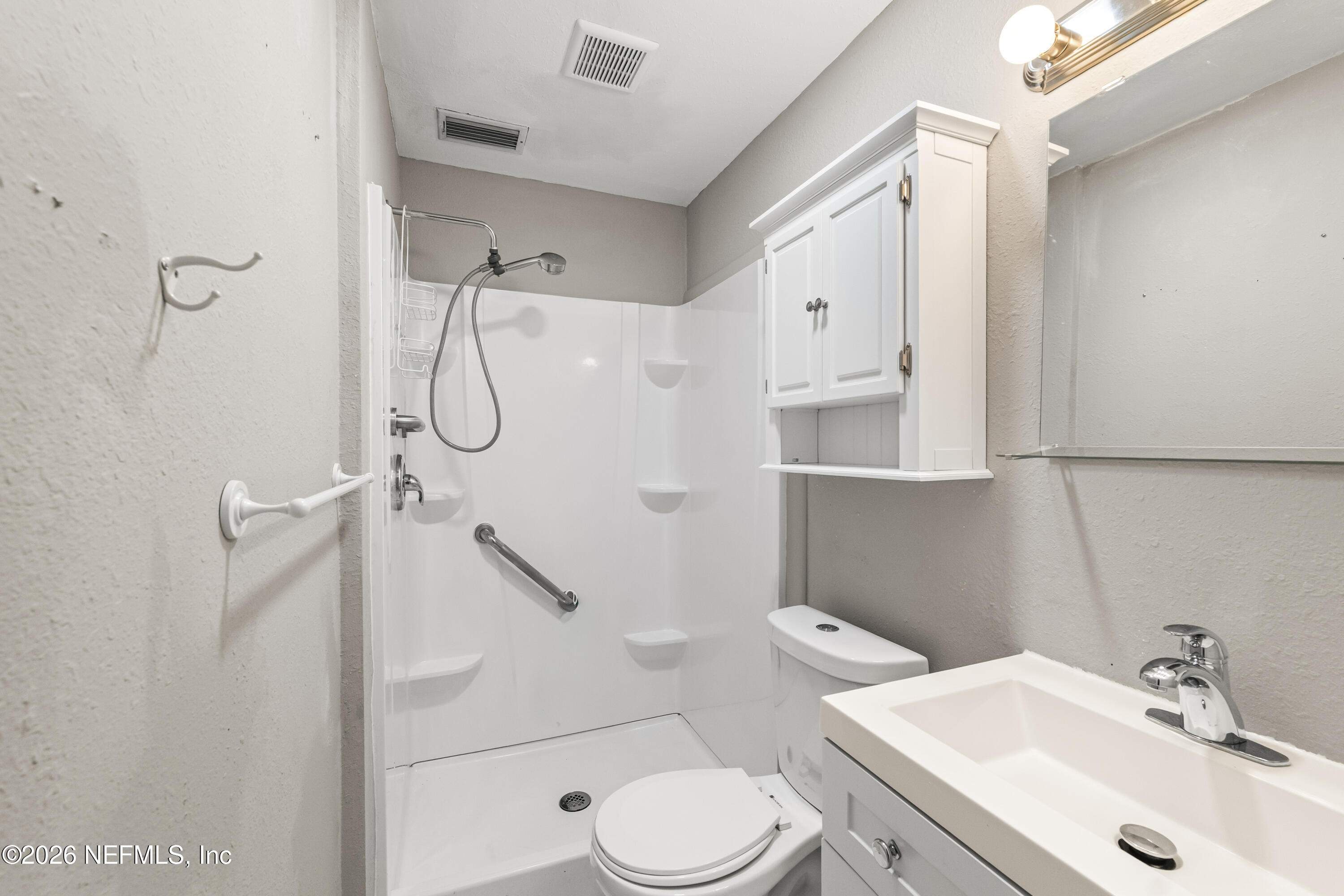 10612 Fort Caroline Road Jacksonville, FL 32225 - Photo 26 of 51 a bathroom with a sink toilet and shower