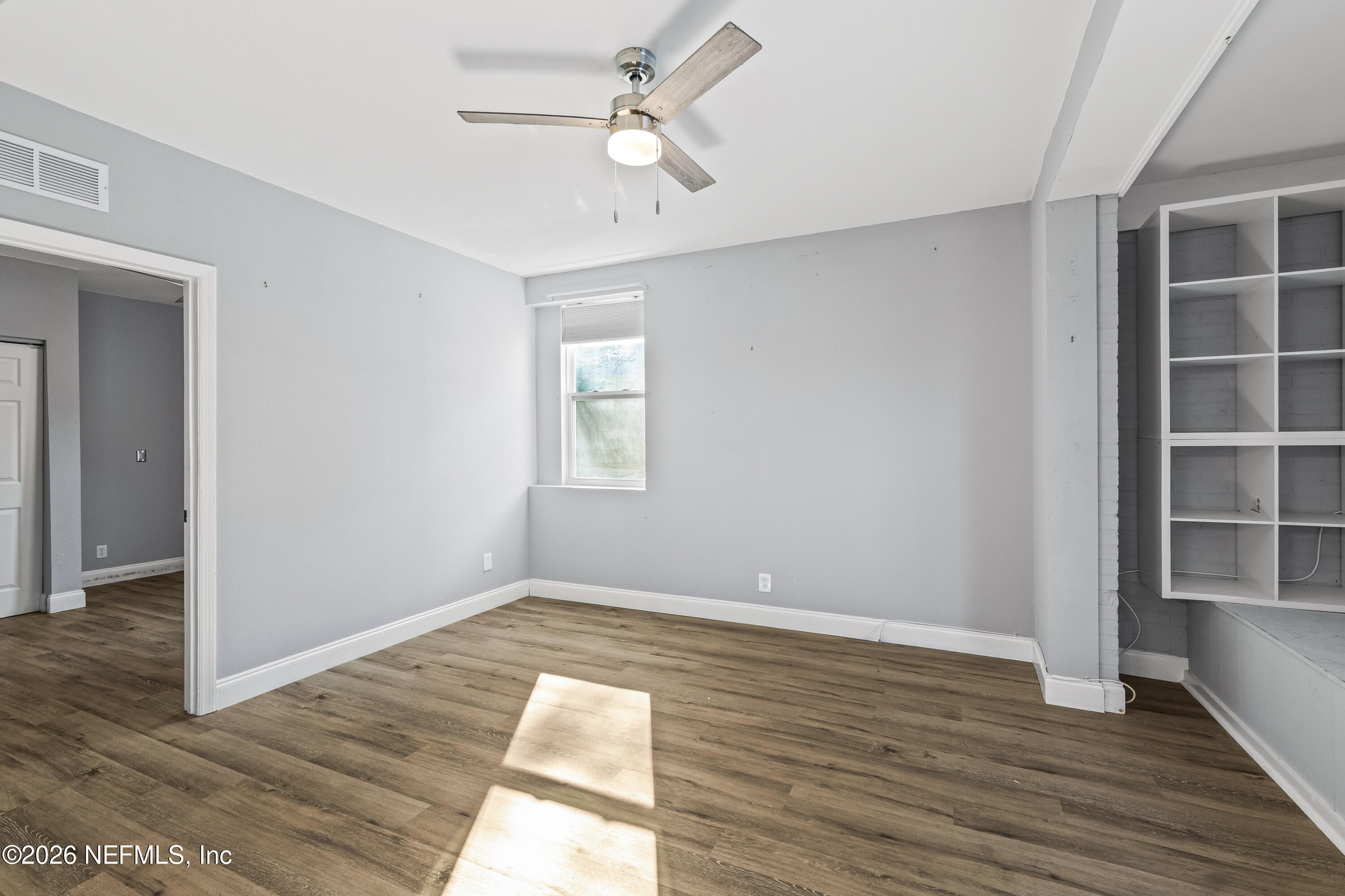 10612 Fort Caroline Road Jacksonville, FL 32225 - Photo 28 of 51 a view of empty room with wooden floor and fan