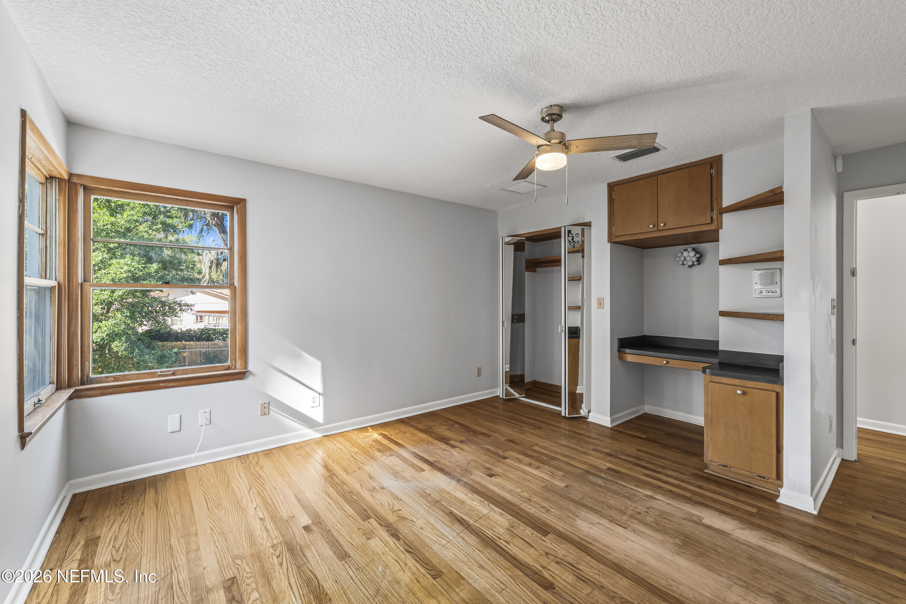 10612 Fort Caroline Road Jacksonville, FL 32225 - Photo 38 of 51 a view of a kitchen with wooden floor a ceiling fan and wooden floor