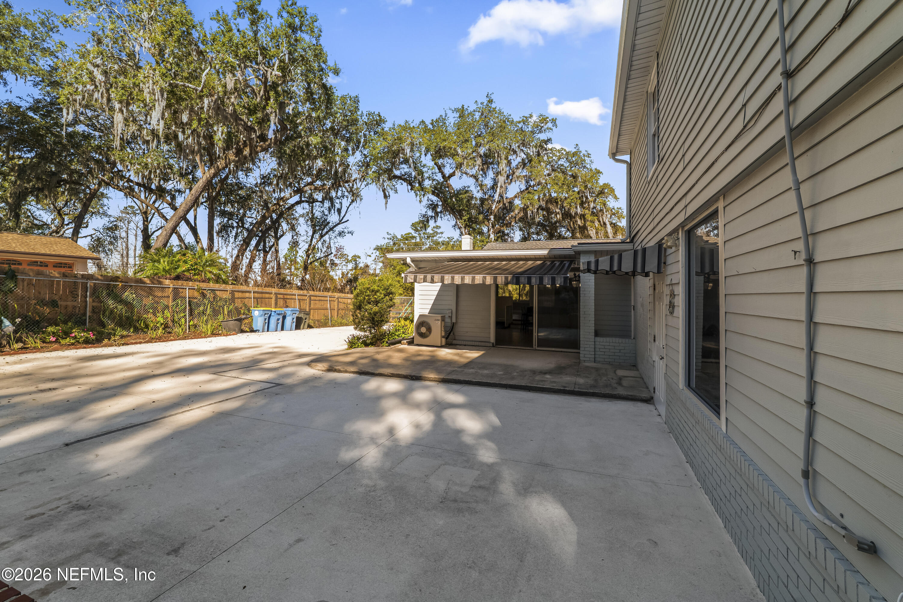 10612 Fort Caroline Road Jacksonville, FL 32225 - Photo 42 of 51 a view of a house with a tree and a yard