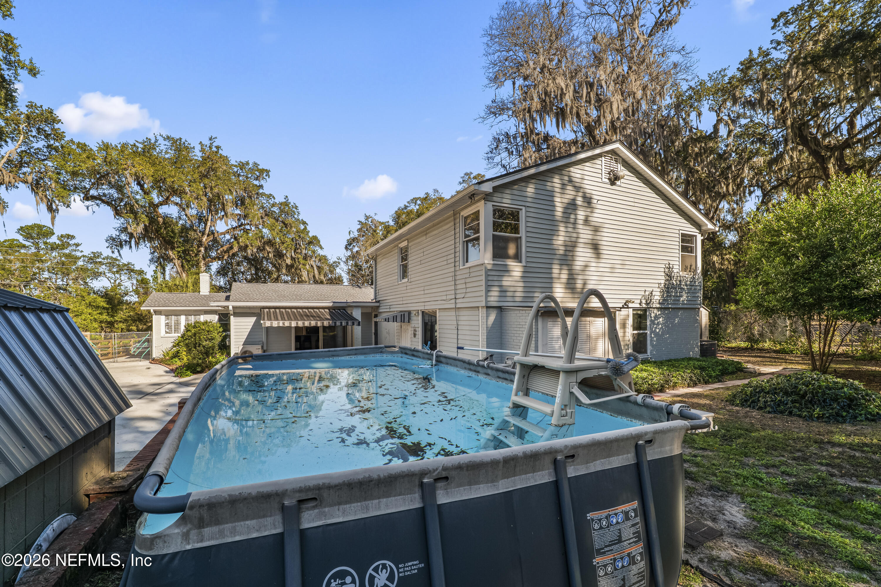 10612 Fort Caroline Road Jacksonville, FL 32225 - Photo 43 of 51 a view of a house with backyard and sitting area