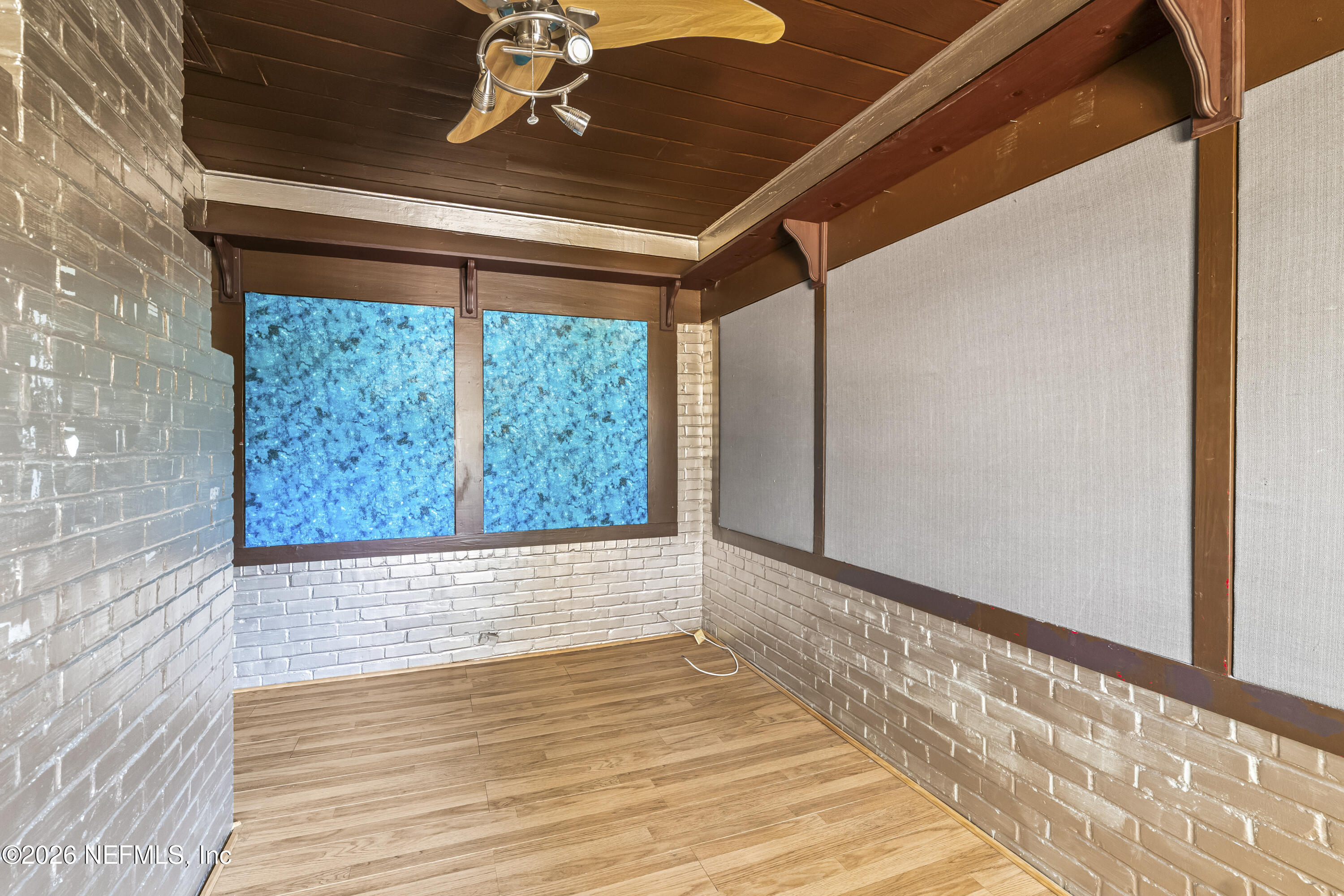 10612 Fort Caroline Road Jacksonville, FL 32225 - Photo 5 of 51 a view of empty room with wooden floor and fan