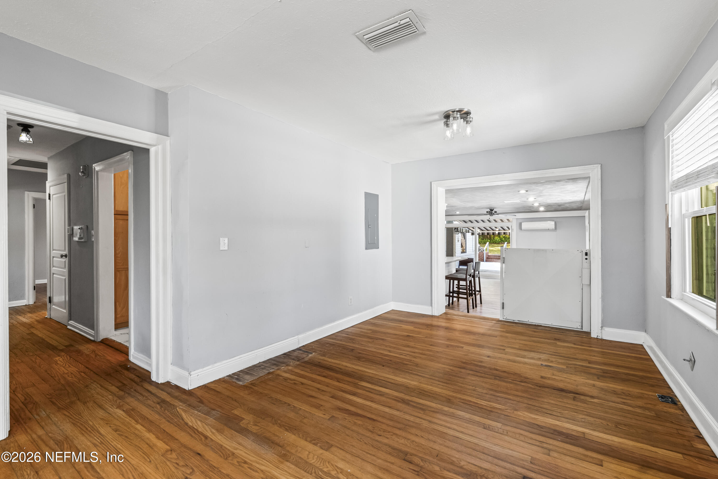 10612 Fort Caroline Road Jacksonville, FL 32225 - Photo 6 of 51 a bedroom with a bed and wooden floor