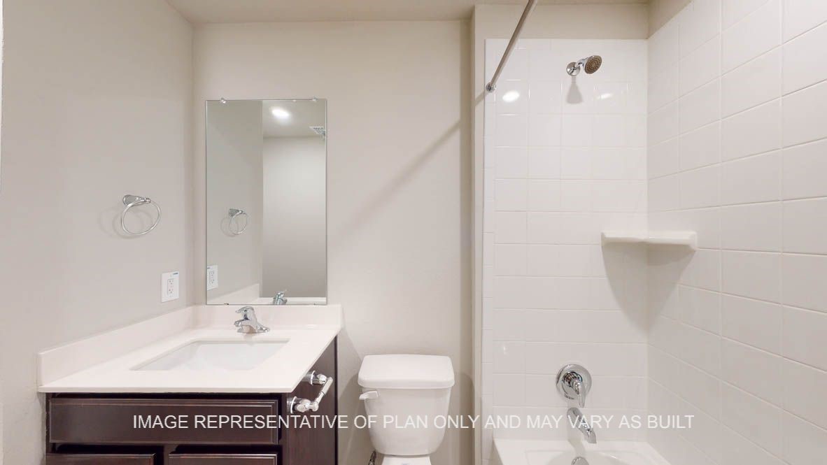 3101 Taddy Road Lorena, TX 76655 - Photo 25 of 27 a bathroom with a sink a toilet and a mirror