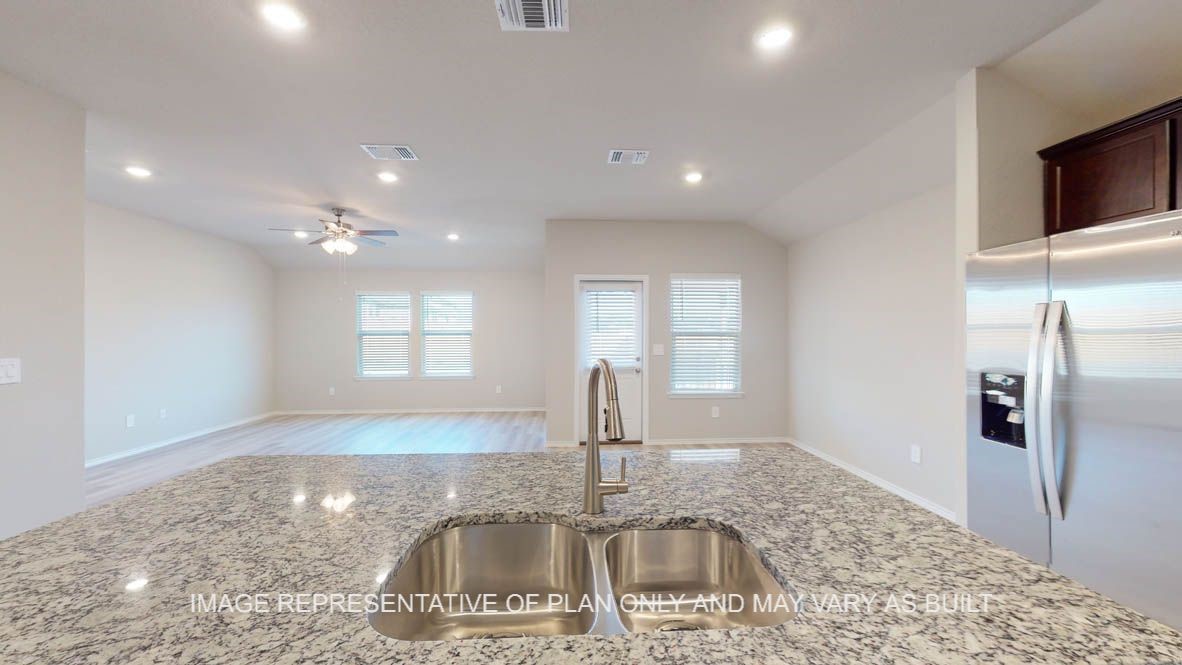 3101 Taddy Road Lorena, TX 76655 - Photo 7 of 27 a kitchen with kitchen island a sink stainless steel appliances cabinets and a counter top space