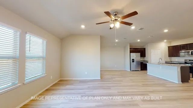 a view of a kitchen with a sink and a window