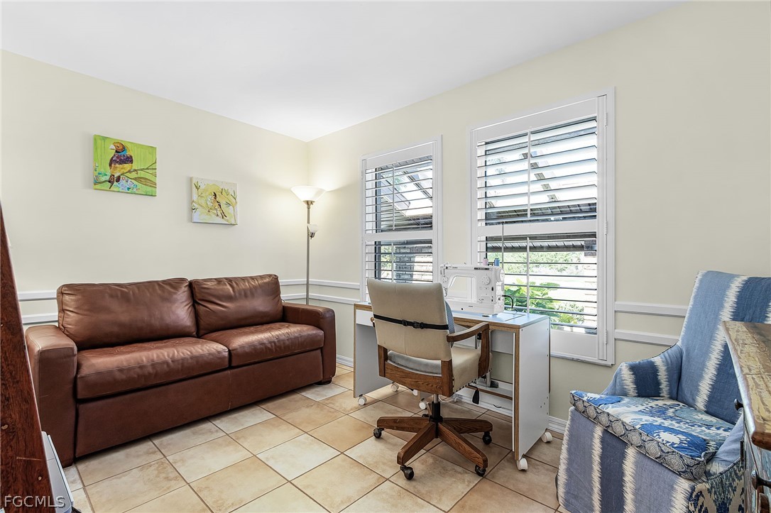 7747 Grande Pine Road Bokeelia, FL 33922 - Photo 19 of 45 a living room with furniture and a window