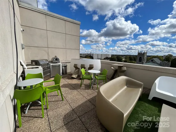 a view of a patio with couches and potted plants