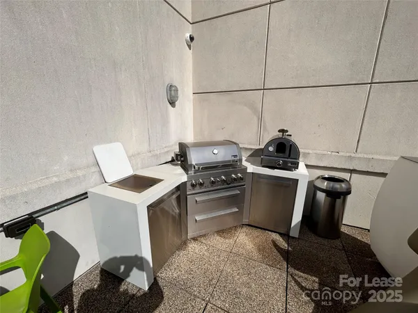 a kitchen with a stove a sink and a refrigerator