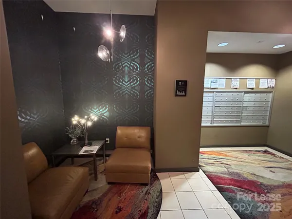 a spacious bedroom with a bed and a mirror