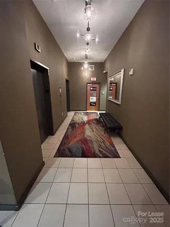 a view of an empty room and wooden floor