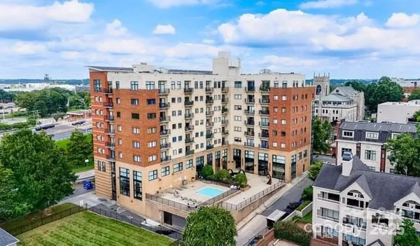 a view of a building with a yard