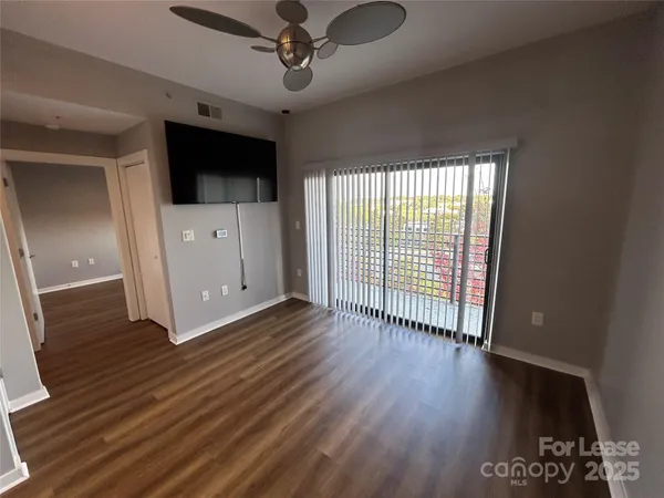 a view of a livingroom with wooden floor