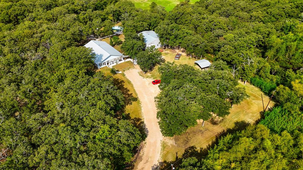 536 Cavin Lane Axtell, TX 76624 - Photo 2 of 40 a view of a house in a forest