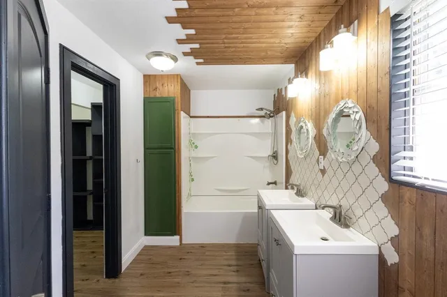 a view of walk in closet with empty racks