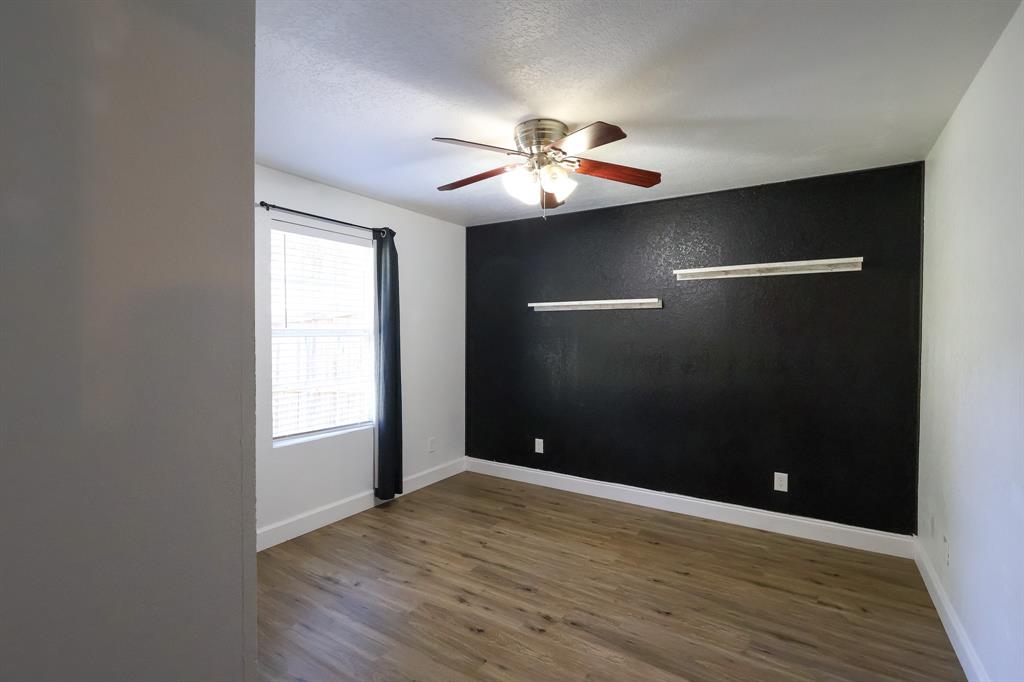536 Cavin Lane Axtell, TX 76624 - Photo 28 of 40 wooden floor in an empty room with a window
