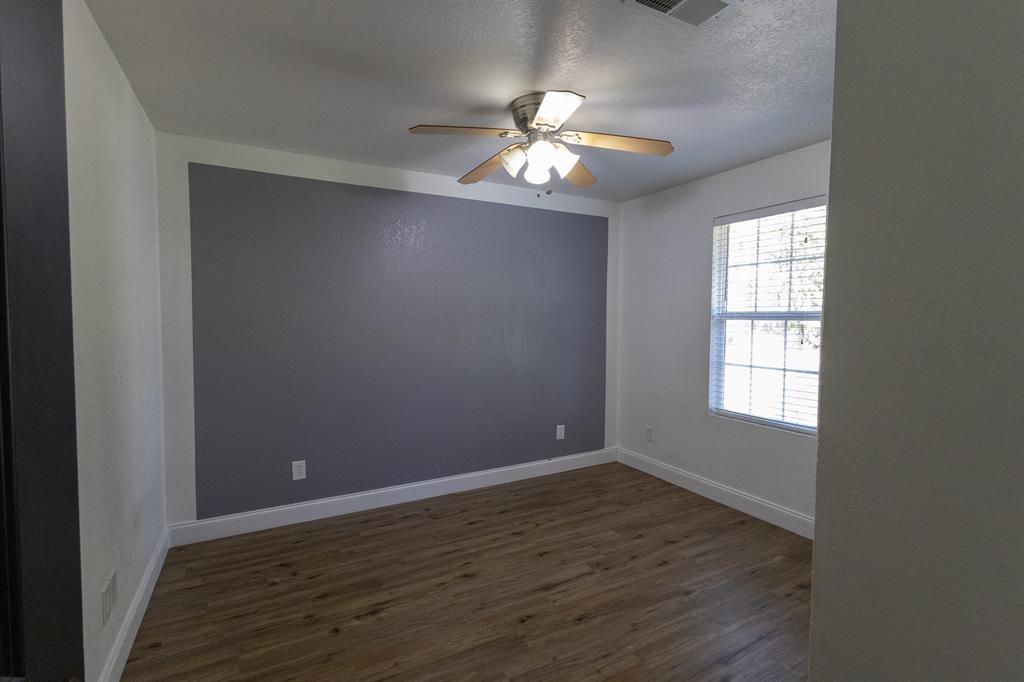 536 Cavin Lane Axtell, TX 76624 - Photo 31 of 40 wooden floor in an empty room with a window