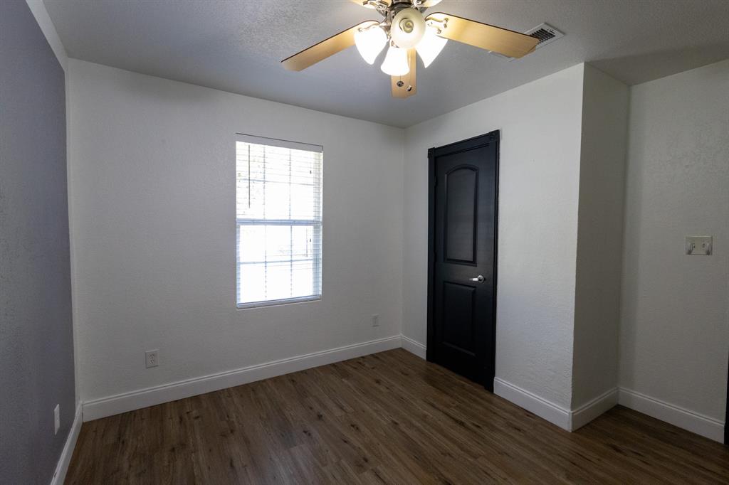 536 Cavin Lane Axtell, TX 76624 - Photo 32 of 40 an empty room with wooden floor and windows
