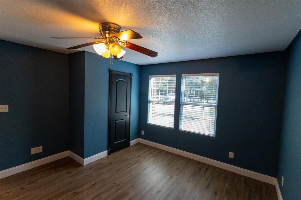 536 Cavin Lane Axtell, TX 76624 - Photo 36 of 40 a view of an empty room with window and wooden floor
