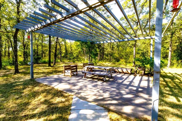 a view of yard with swimming pool