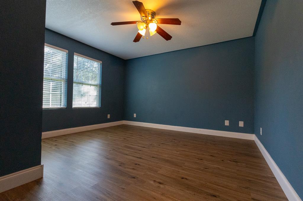 536 Cavin Lane Axtell, TX 76624 - Photo 9 of 40 a view of an empty room with window and wooden floor