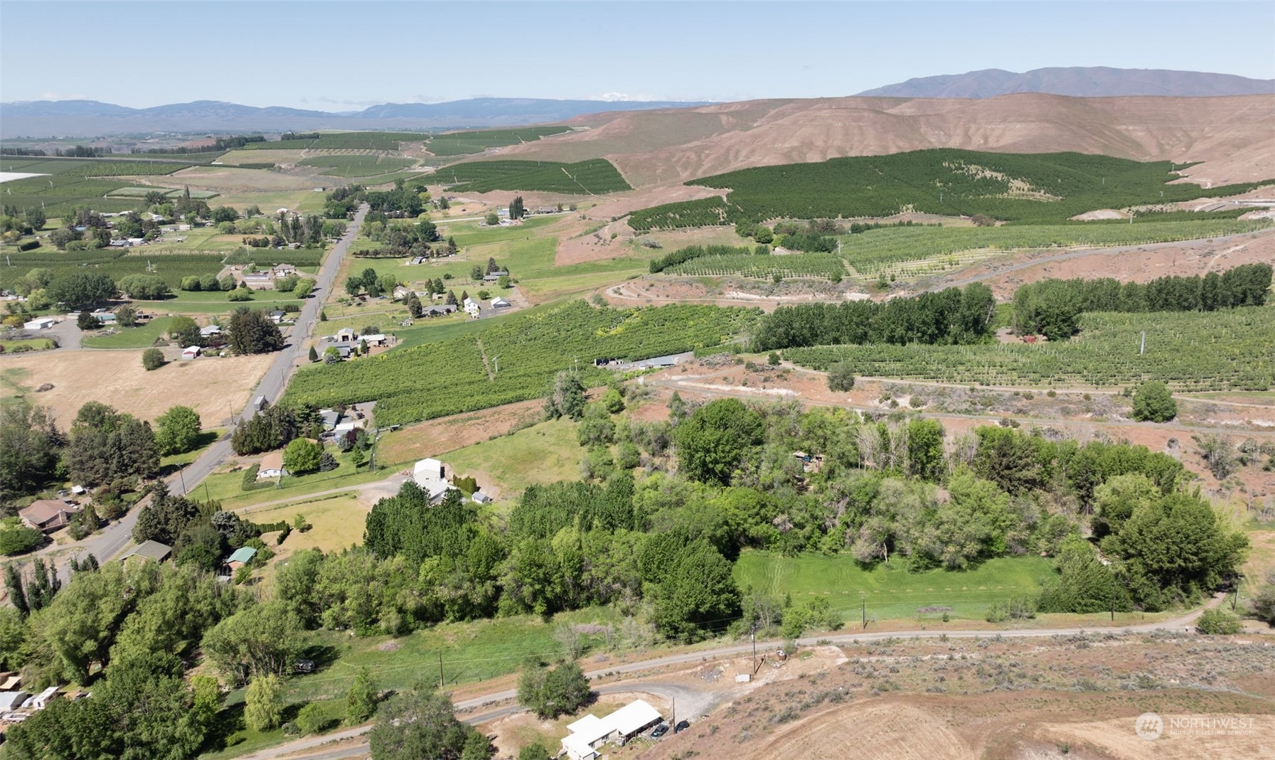0 Collins Road Selah, WA 98942 - Photo 6 of 14 an aerial view of residential houses with outdoor space and street view