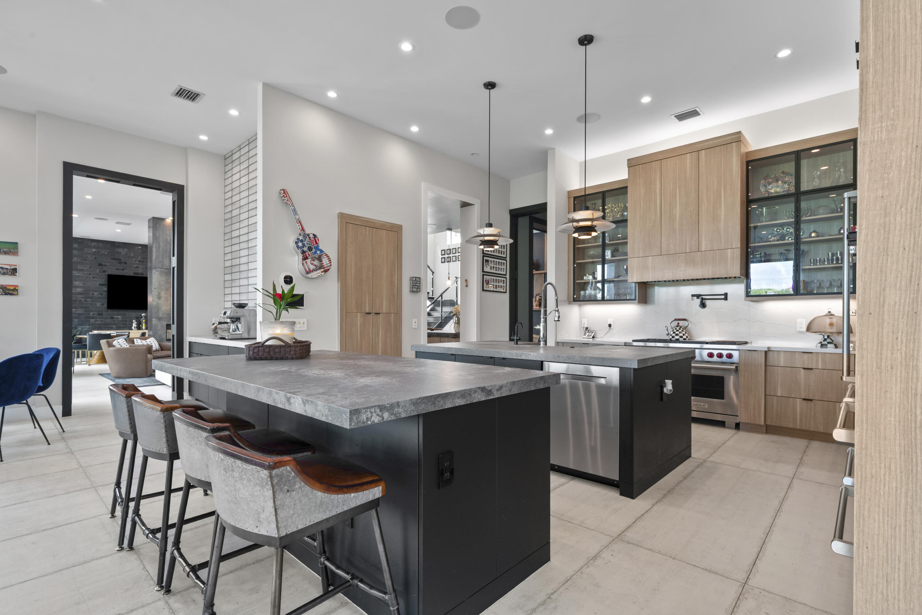 9771 Chianti Classico Terrace Boca Raton, FL 33496 - Photo 22 of 114 a kitchen with stainless steel appliances granite countertop a stove refrigerator sink and chairs