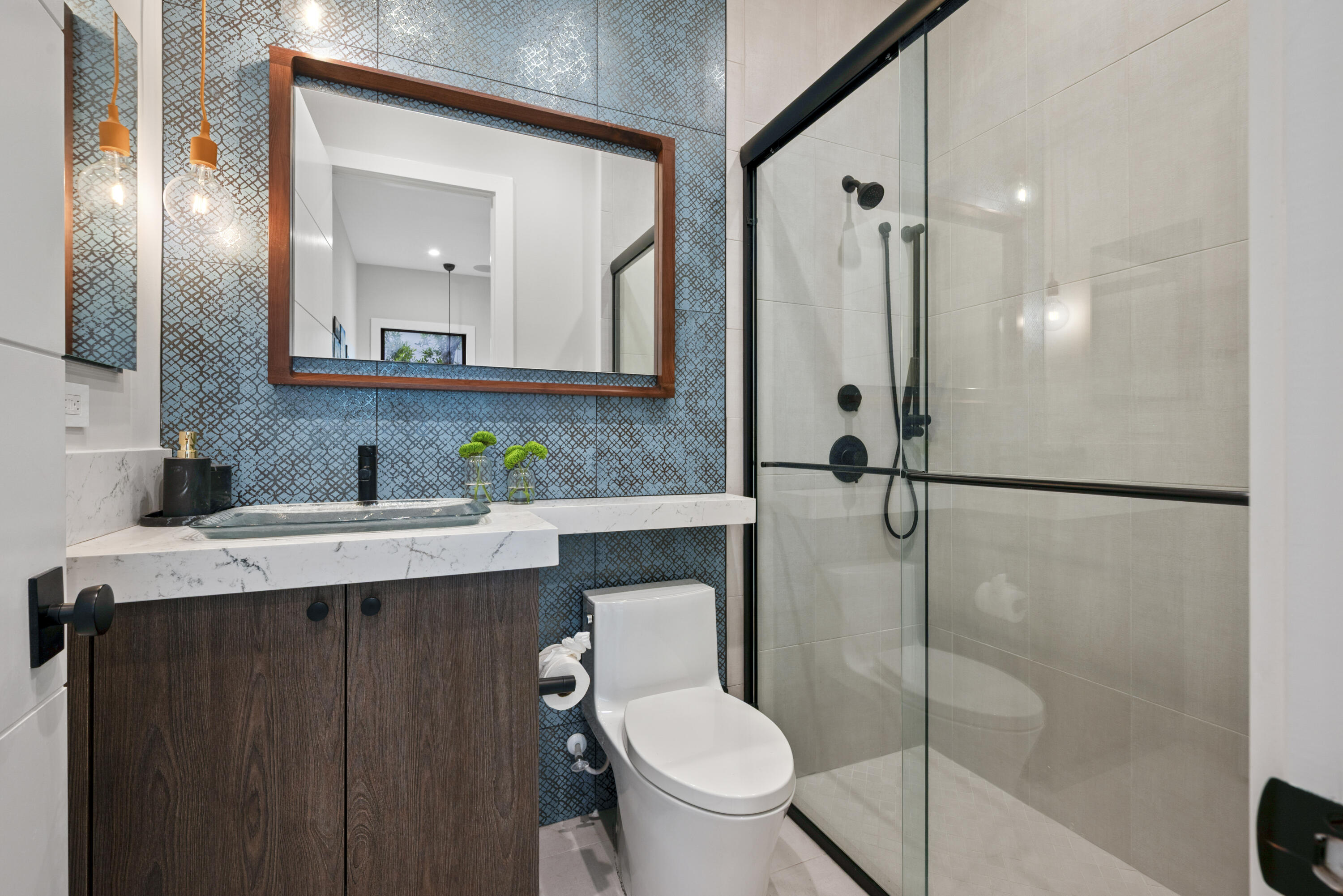 9771 Chianti Classico Terrace Boca Raton, FL 33496 - Photo 38 of 114 a bathroom with a granite countertop sink toilet mirror and shower